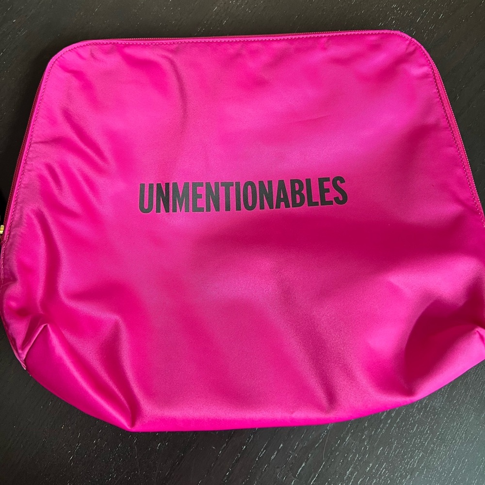 Kate Spade “Unmentionables” travel pouch for lingerie in pink & orange